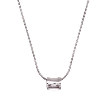 Minimalist necklace with a clear stone pendant – symbolising strength through simplicity.