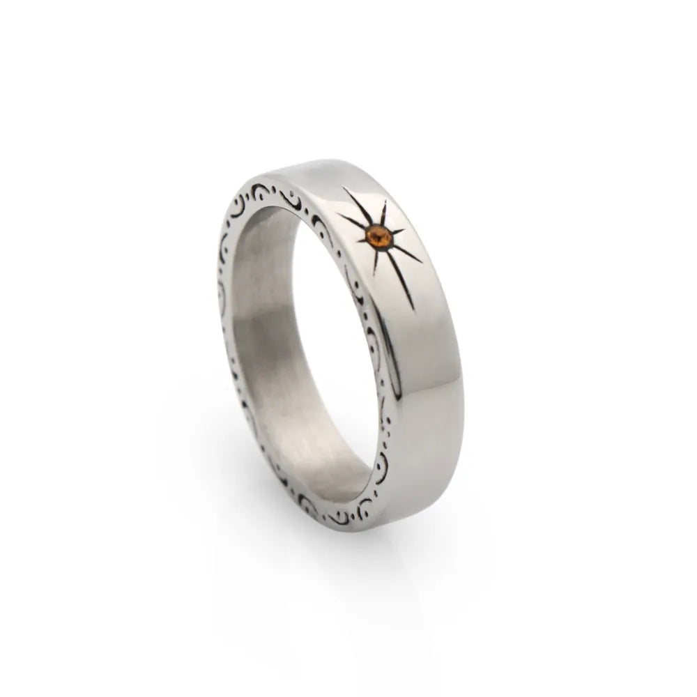 Polished band ring with engraved star totem – a timeless piece with spiritual intention and simplicity.