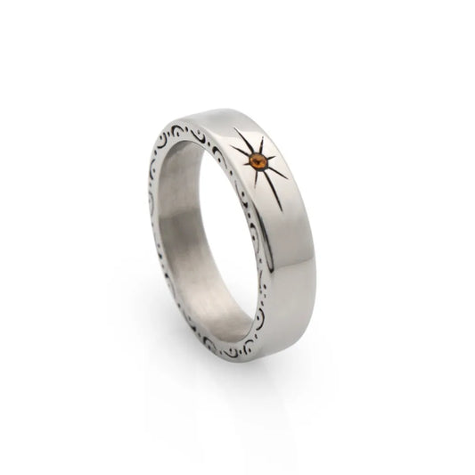 Polished band ring with engraved star totem – a timeless piece with spiritual intention and simplicity.