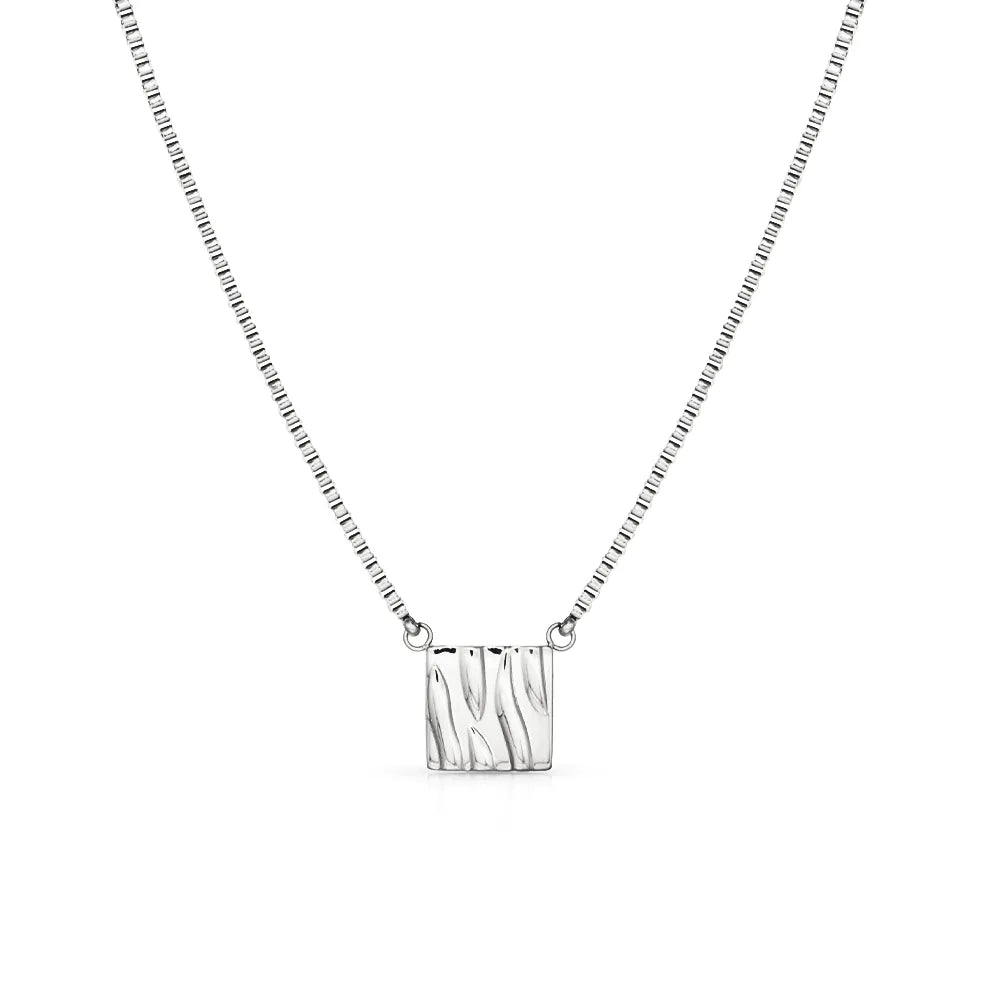 Rectangle pendant necklace with a ripple texture – reflecting movement, water, and calm energy.