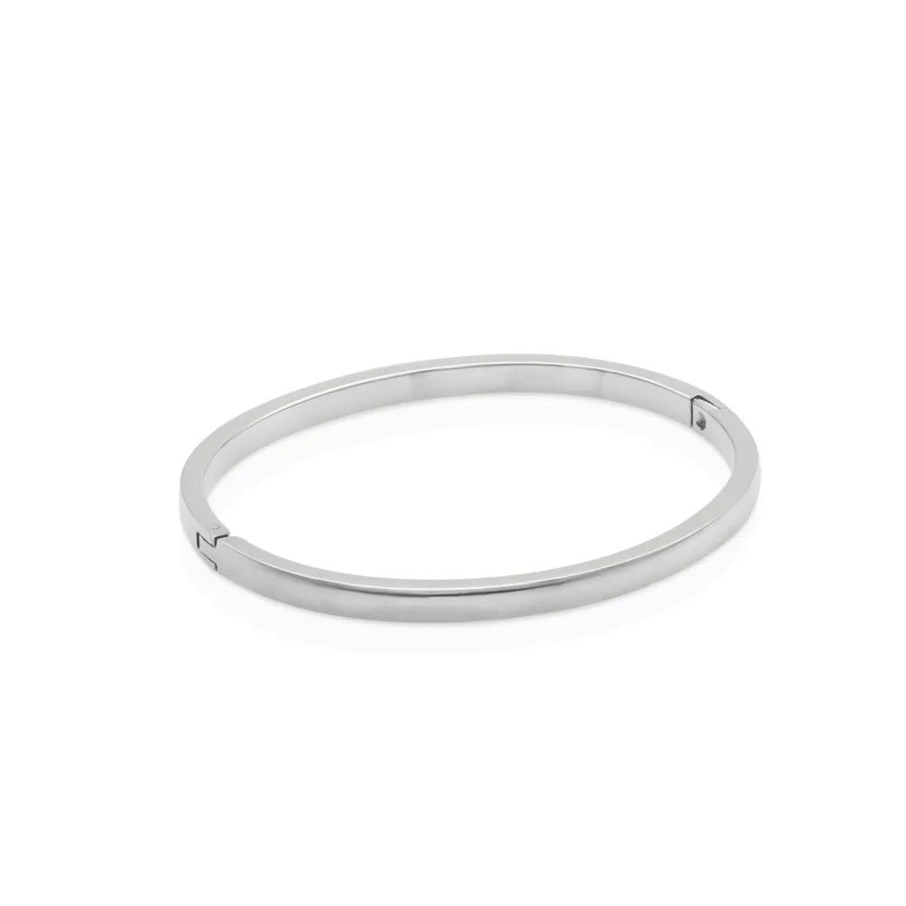 Minimalist silver bangle bracelet with a sleek, smooth finish – designed for movement, simplicity, and refined strength.