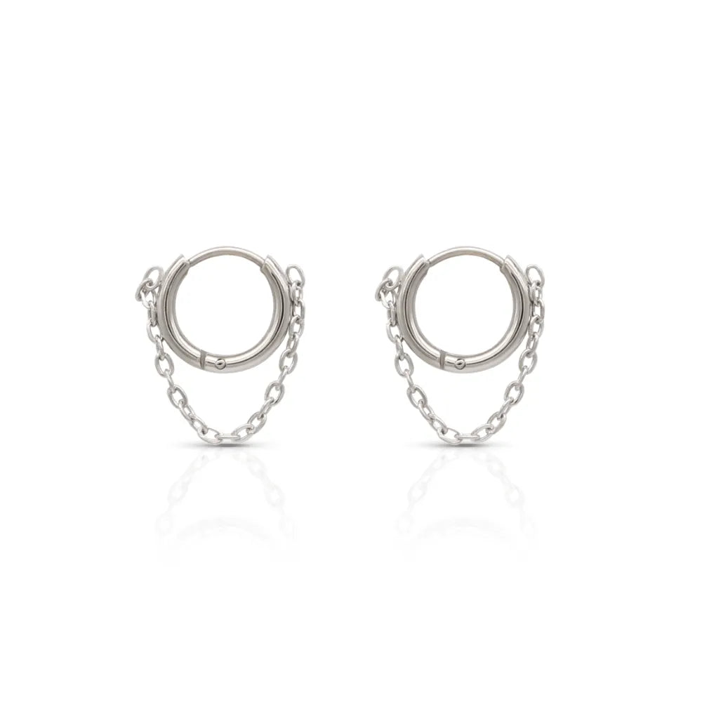 Hoop earrings with chain-link detail – embodying modern structure and fluid strength.