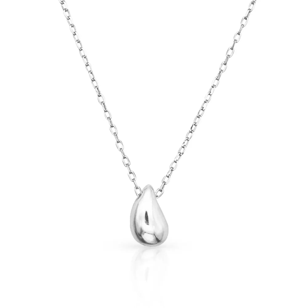 Teardrop silver pendant necklace – representing stillness, emotion, and reflection.