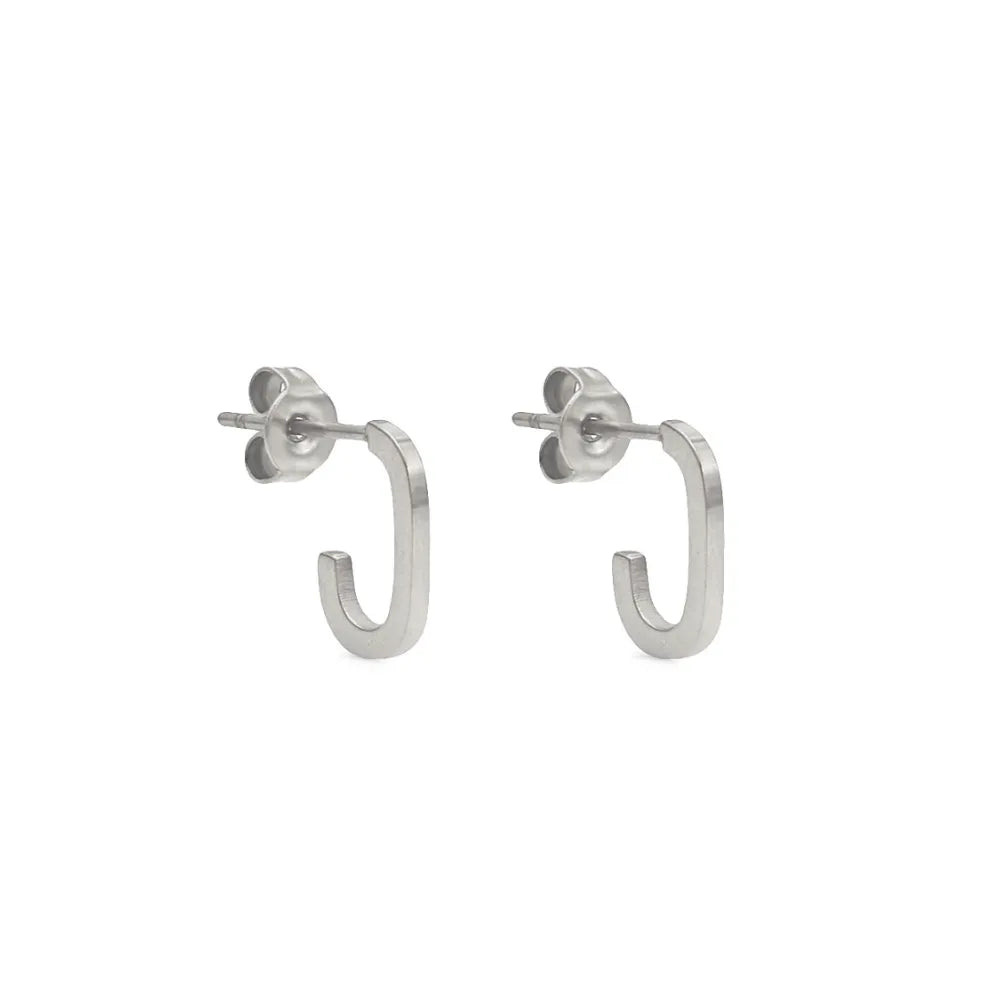 Small open-ended hoop studs – wearable balance of edge and elegance.