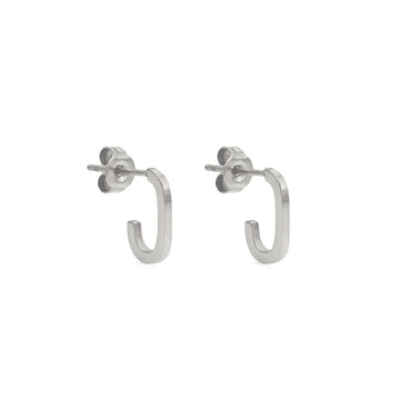 Small open-ended hoop studs – wearable balance of edge and elegance.