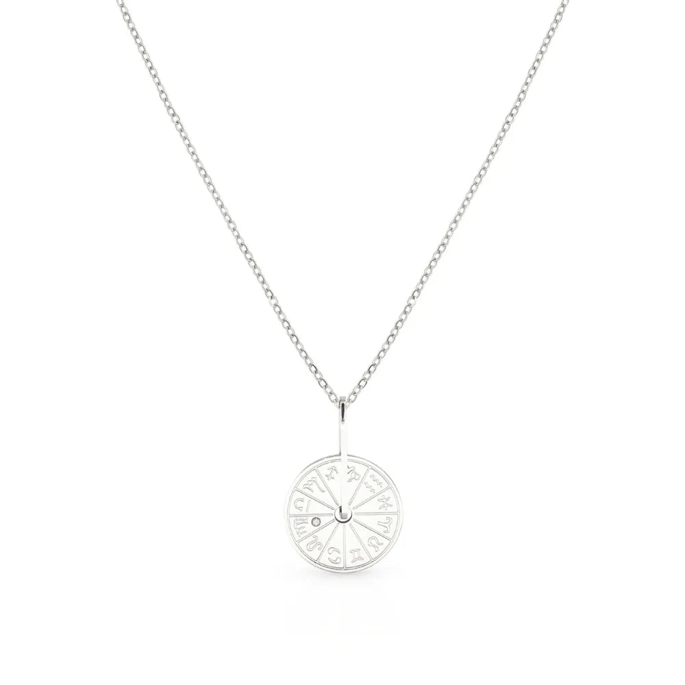 Engraved disc pendant featuring a starburst – designed to channel inner radiance.