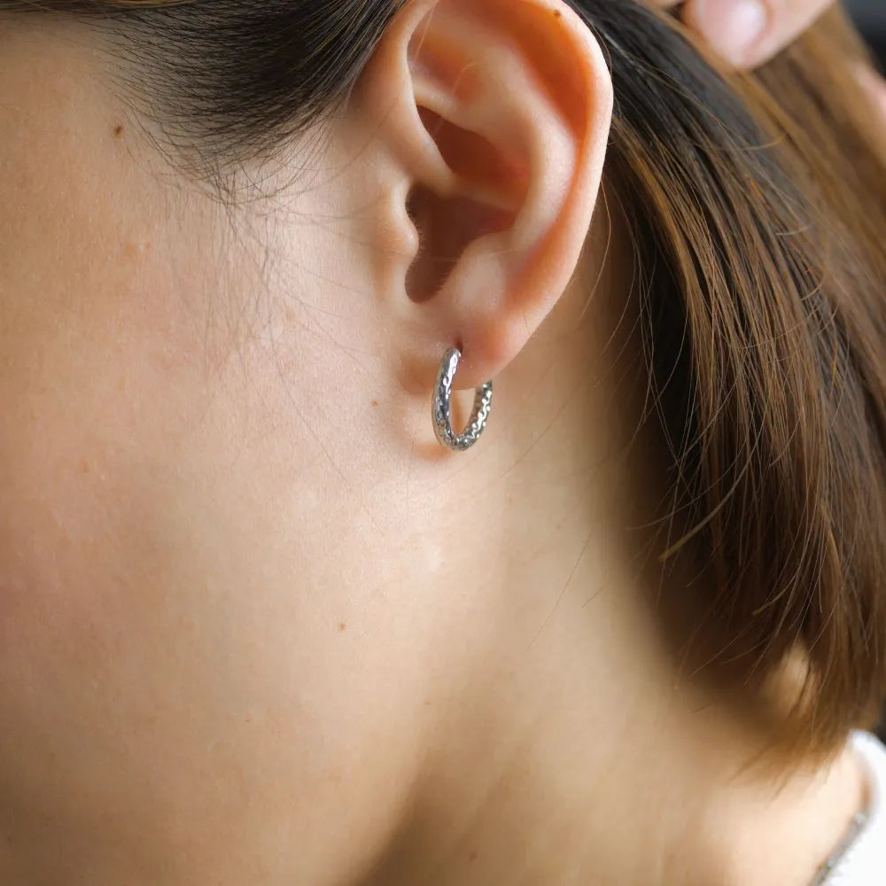 Natural textured hoop earrings – a tribute to rooted strength and earth-aligned design.