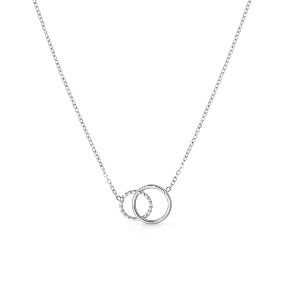 Interlocking circle pendant necklace – minimal expression of unity and resilience.